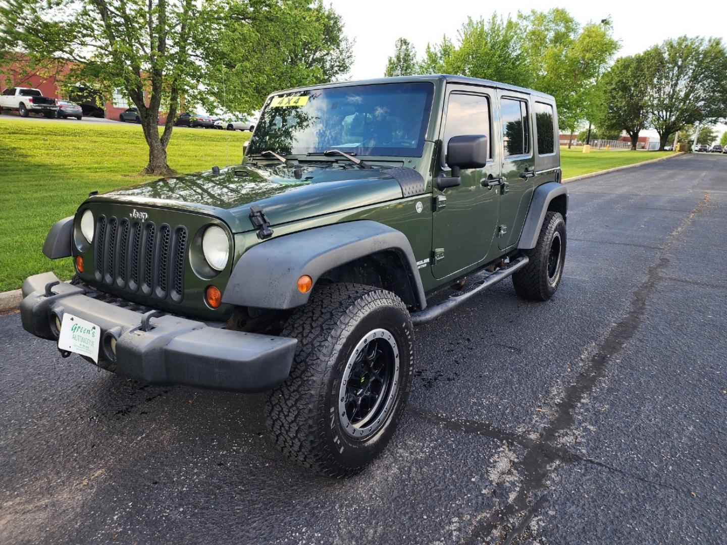 2008 Green /Black Jeep Wrangler Unlimited Rubicon (1J4GA69158L) with an 3.8L V6 OHV 12V engine, Automatic transmission, located at 1221 Madison St., Shelbyville, TN, 37160, (931) 680-9439, 0.000000, 0.000000 - Photo#0